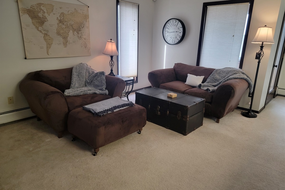 KP101APT5 - Living Room w/love seats, patio access, decorative fireplace, and Roku TV