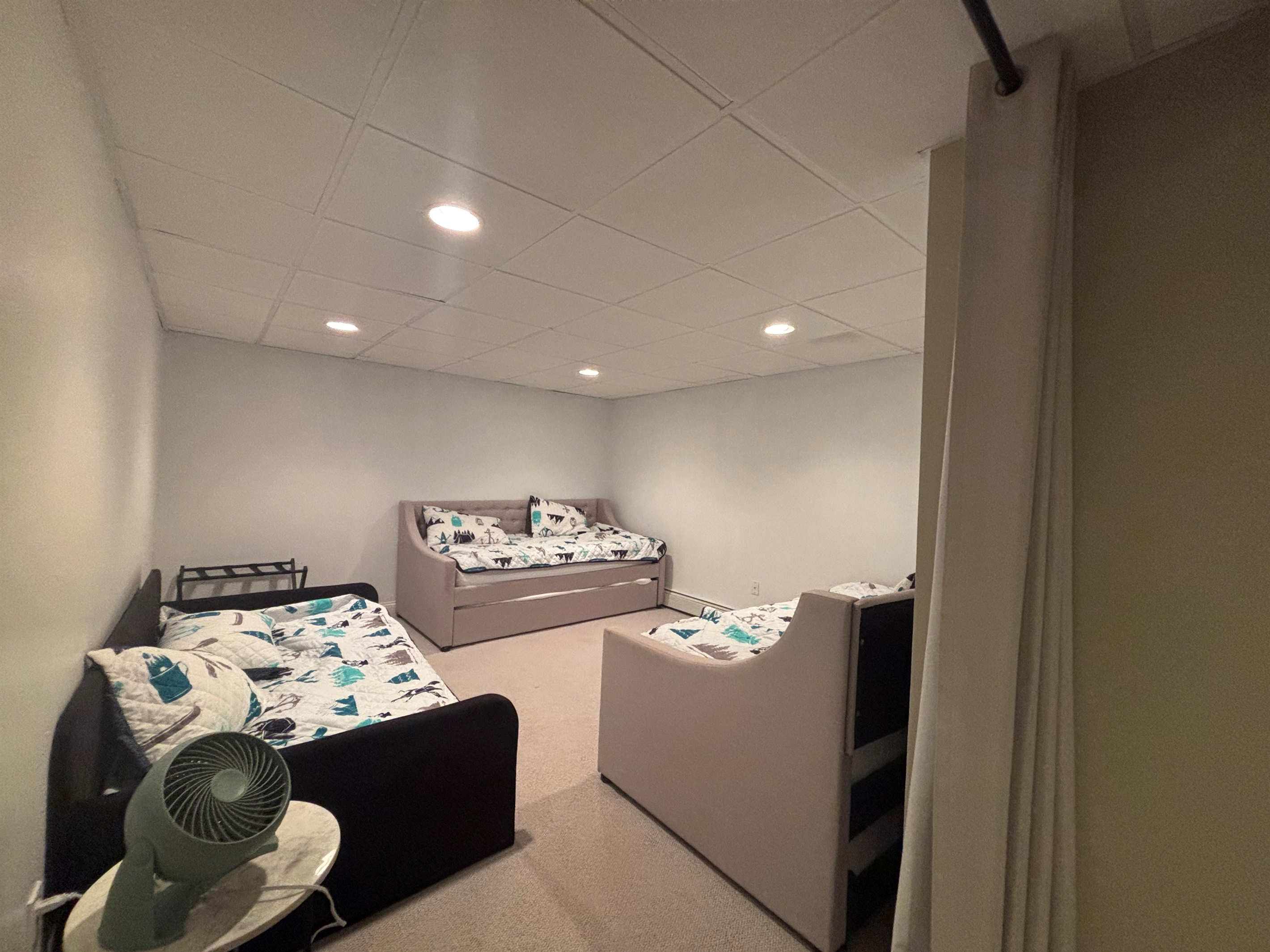 Two twins with trundles and another twin bed, total sleeping space for 5.