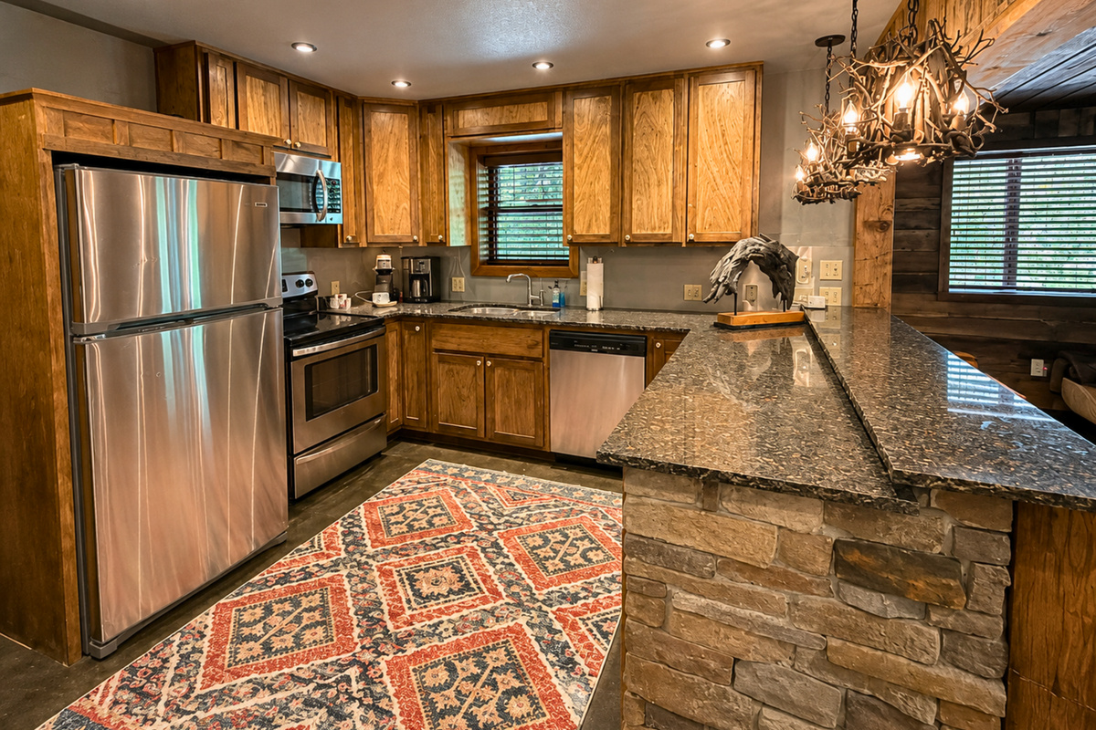 Downstairs, an additional kitchen gives the group even more flexibility for preparing snacks, drinks, or meals without having to head back upstairs.