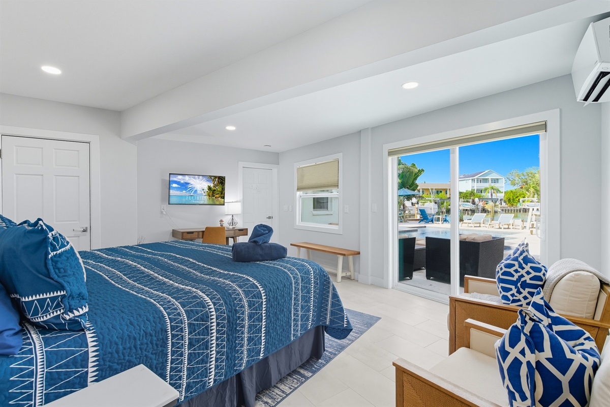 The ground floor master offers a waterview, king bed, smart TV and en suite bathroom.