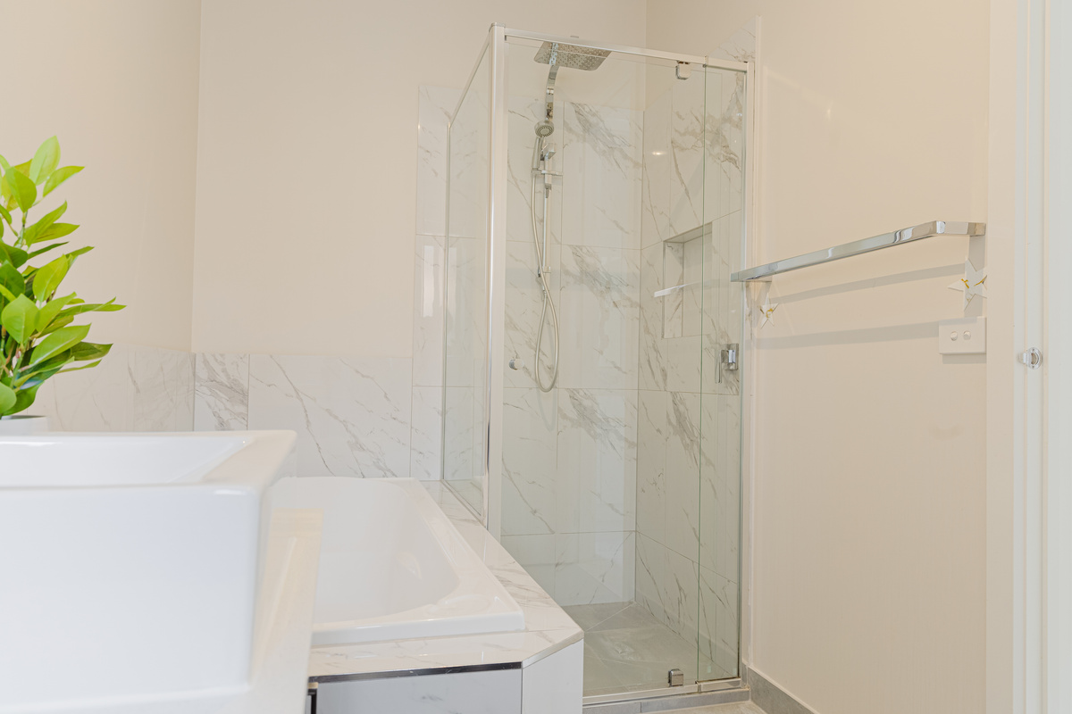 Natural light, a full bath and a clean vanity setup make this bathroom a simple reset space during a stay at Willows Stays Holiday.