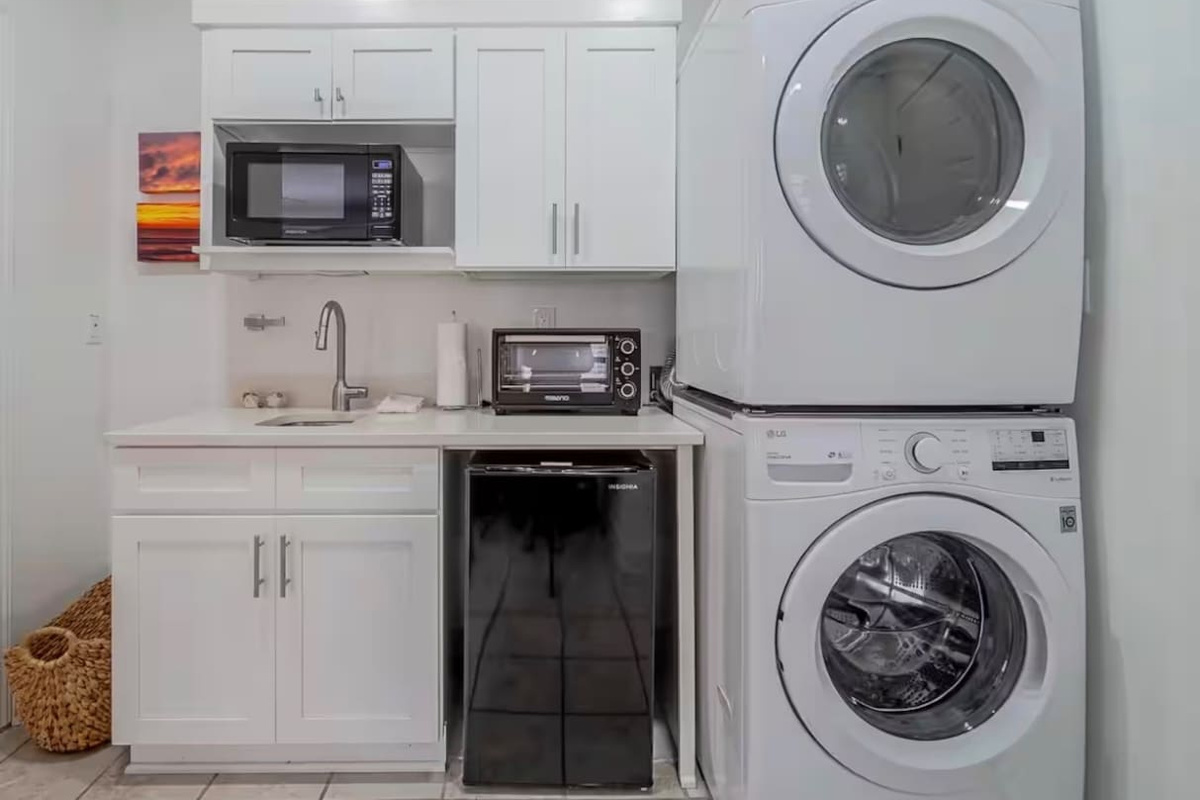 Kitchenette on bottom floor with 2nd laundry set in the bunk room area
