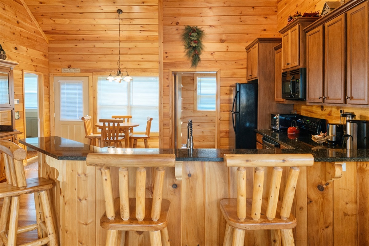 Eat-in Kitchen with Bar Seating. Did you know, we actually have multiple locations to sit & eat! Formal dining room overlooking the mountains, breakfast nook, bar seating or bringing your meal out to the Patio!
