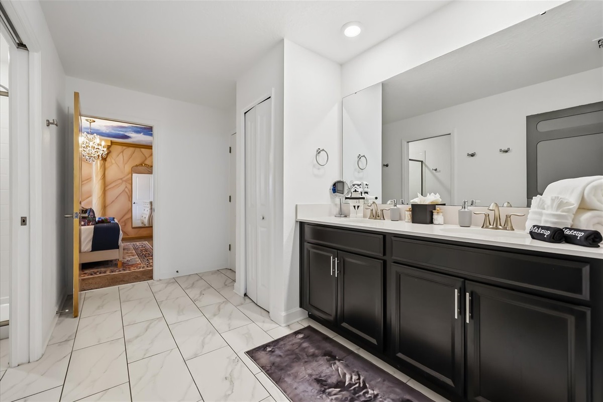 Bathroom shared by Star Wars and Beauty & the Beast bedrooms with an additional hall access door.
