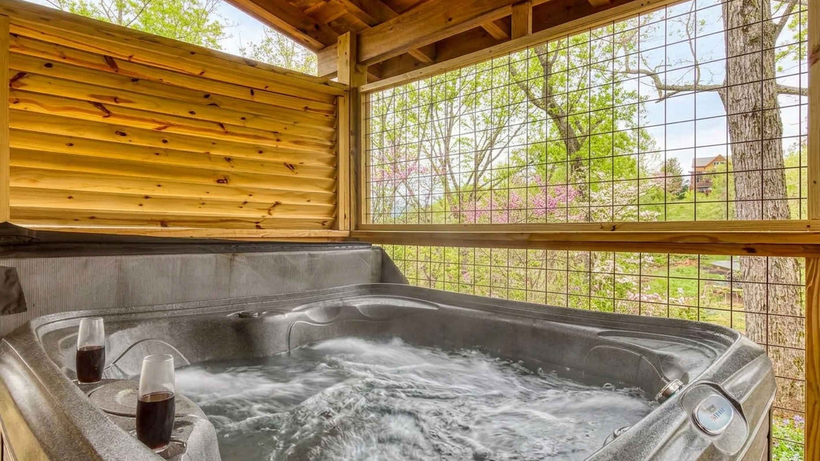 Enjoy a warm soak in the private hot tub while you listen to the breeze move through the trees