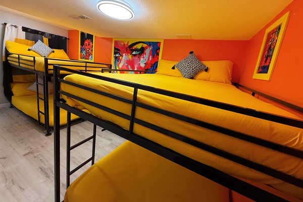 The Ultimate Group Stay – Bunk Room 2 is designed for fun and relaxation, sleeping 4 to 8 guests with two full-sized bunk beds and a 55-inch TV—perfect for families or groups!