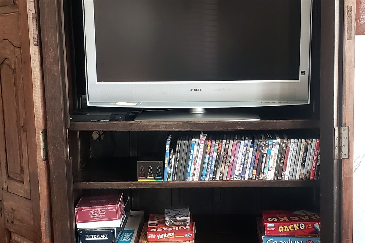 The armoire in the 2nd living area with a TV that plays DVDs and APPs and a Bluetooth soundbar on top to connect to your devices.  There is an assortment of games, puzzles, and DVDs for your enjoyment!