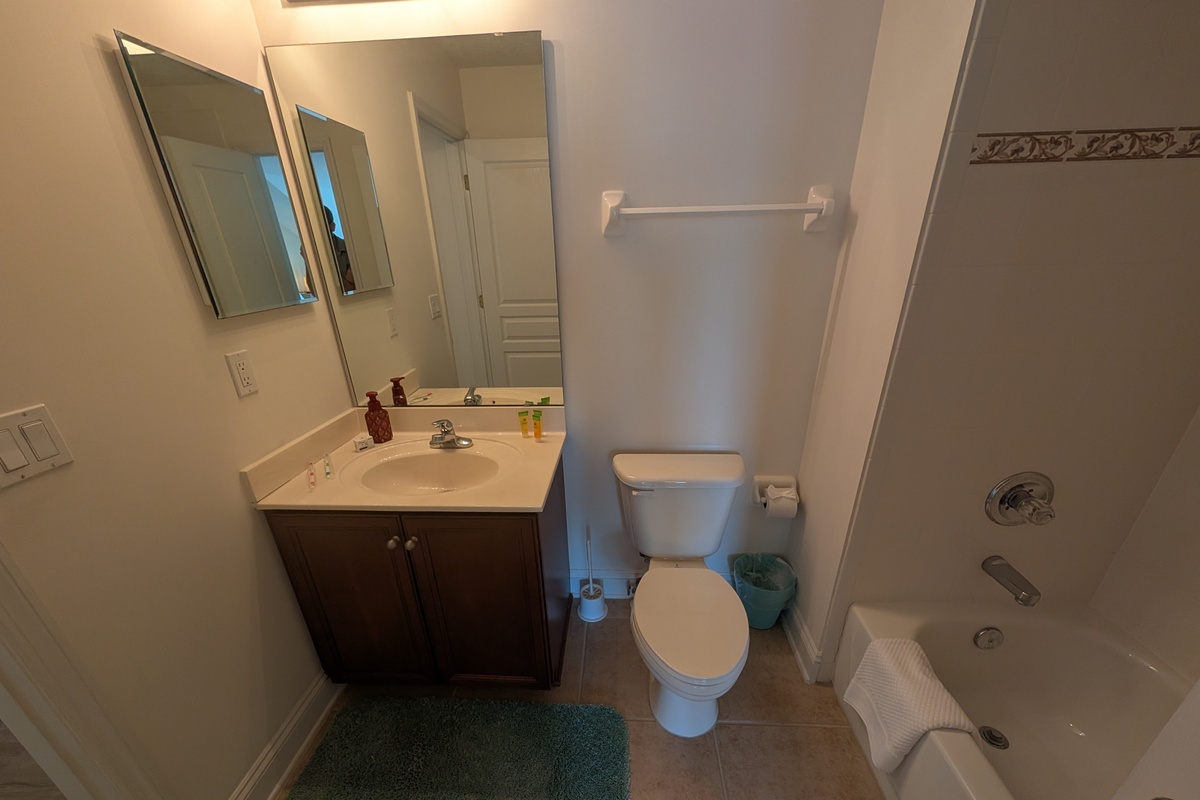 Private bathroom with a full tub and shower combination for an easy start or end to the day.