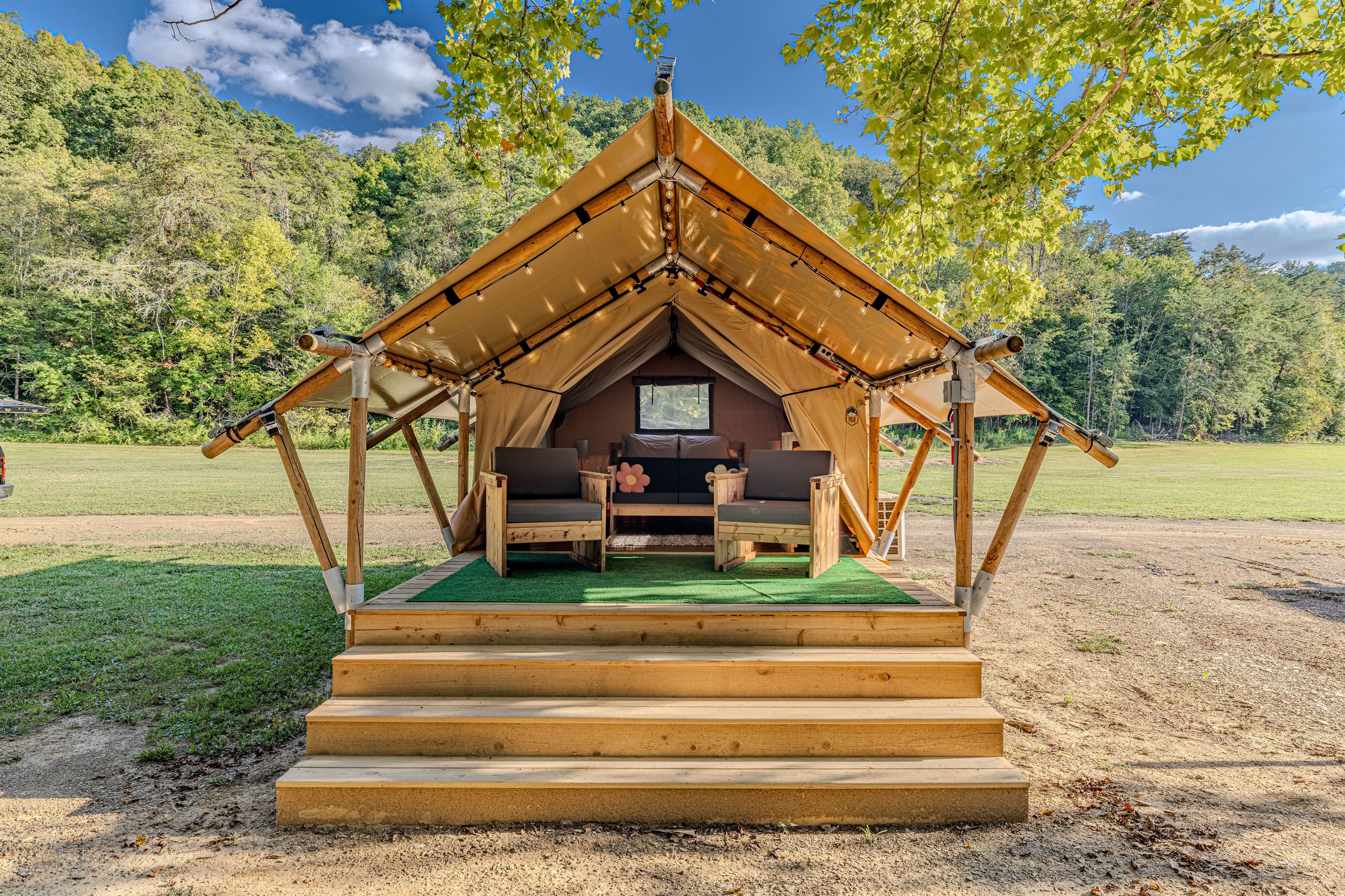 Welcome to Taurus! Your home away from home. Step up to your luxury tent, where a queen bed awaits behind a spacious deck perfect for morning coffee and enjoying the sounds of nature.