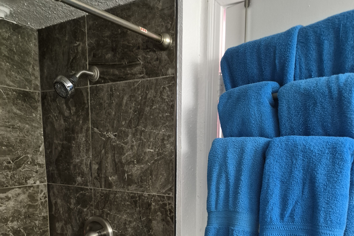 Fluffy towels and custom tile work