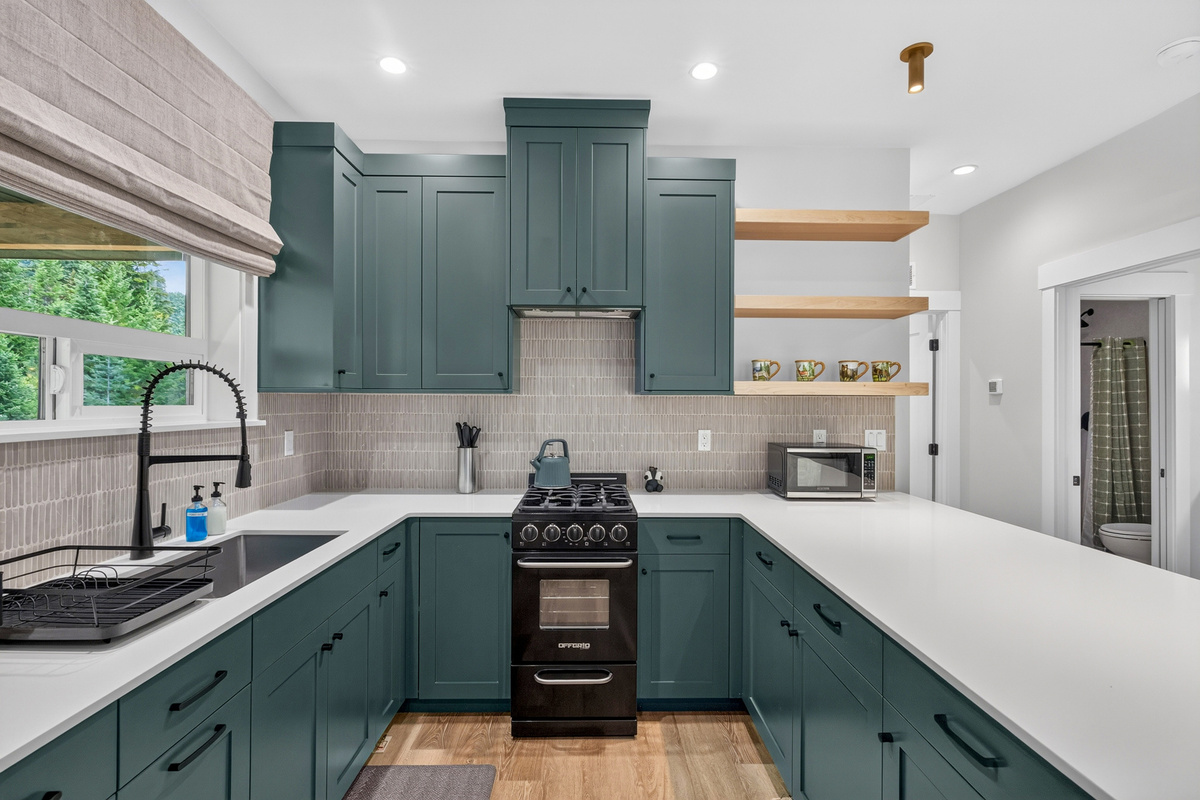 Closer view of the modern and functional kitchen located upstairs.