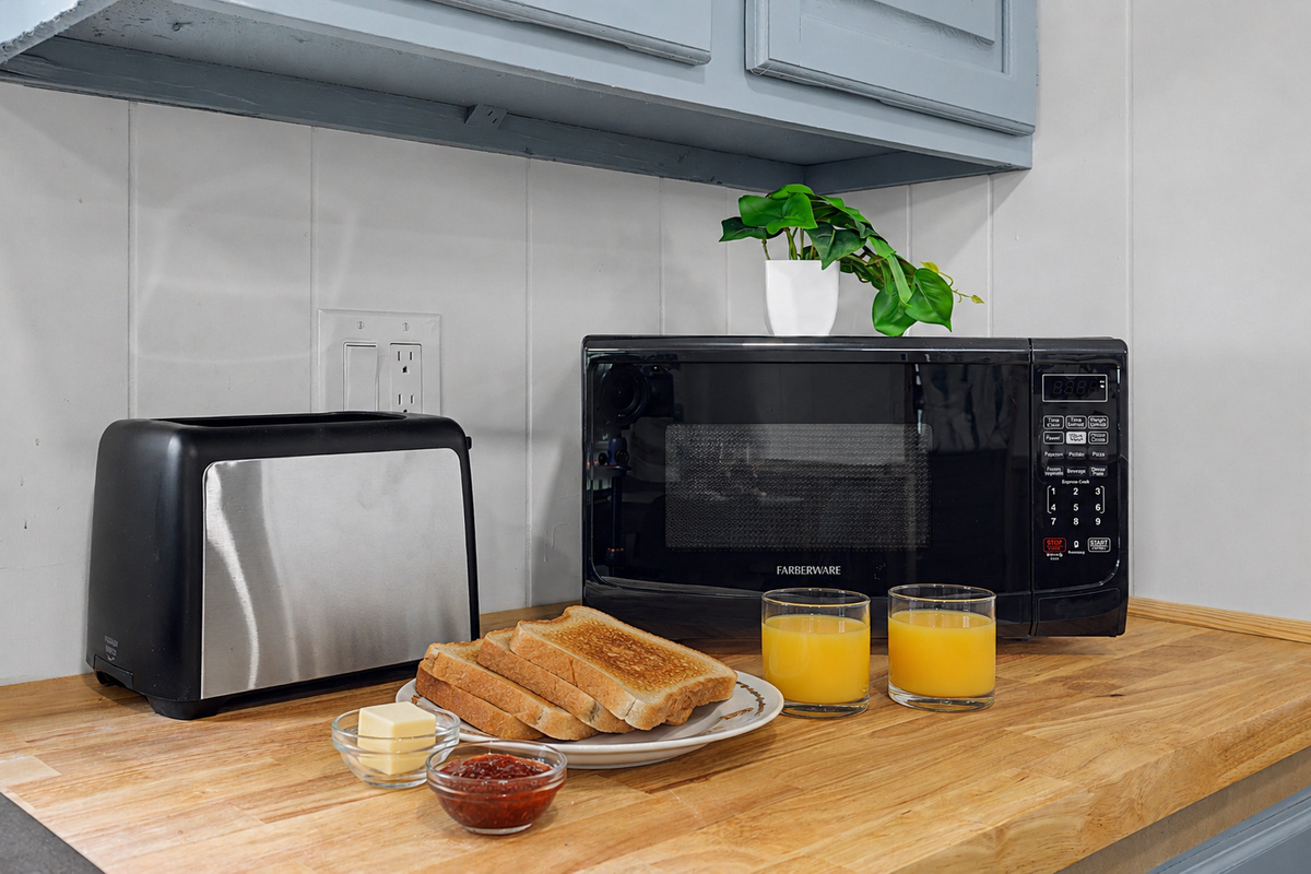 Kitchenette: Start your mornings right with toast, juice, and all the essentials at your fingertips!