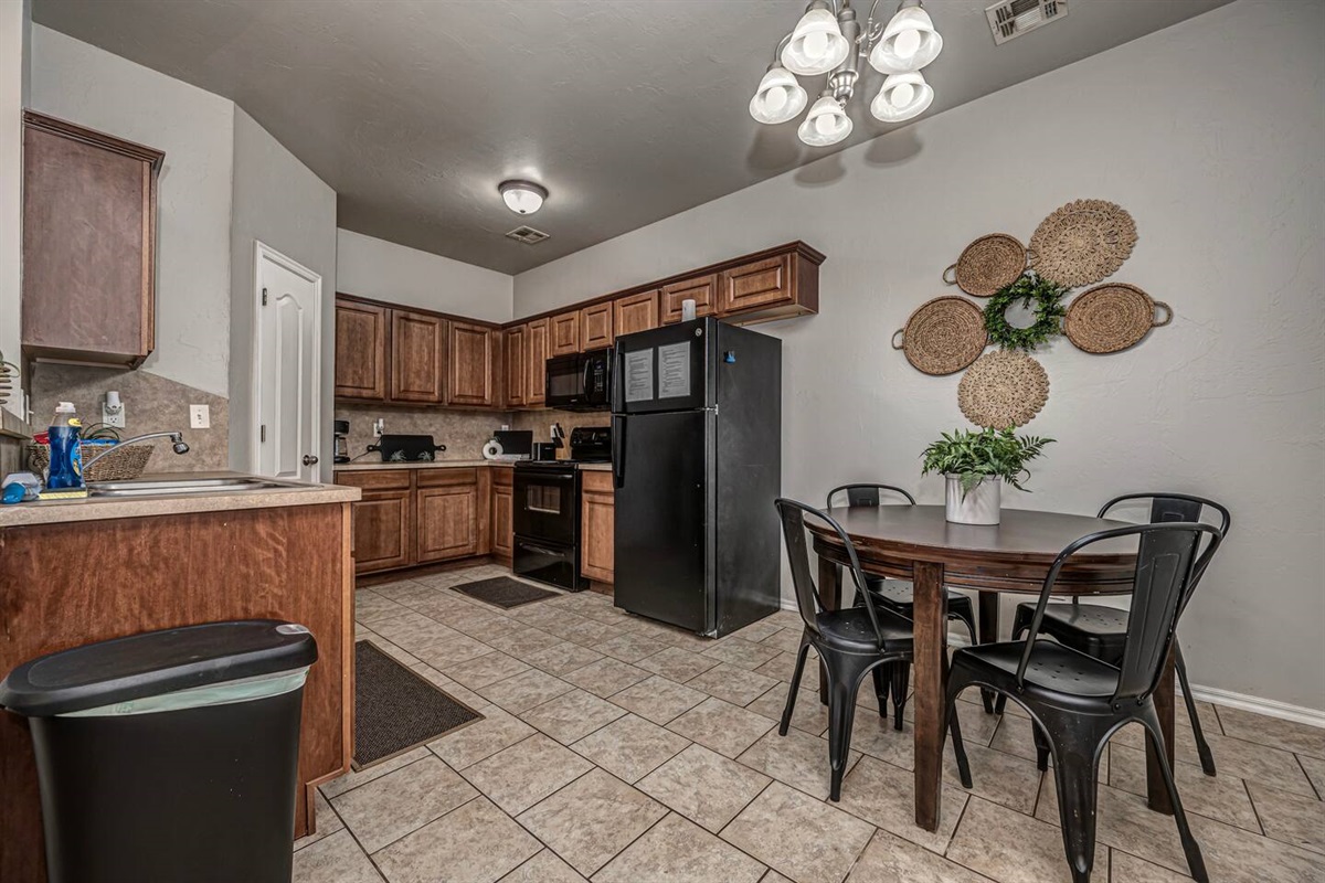 Spacious kitchen with seating for four—perfect for meals or game nights.