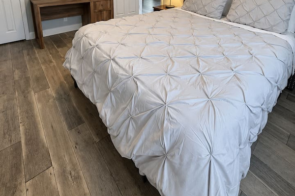 Bedroom Oasis: Relax in style with modern decor, natural light, and a serene atmosphere!