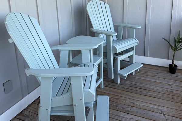 Enjoy your morning coffee in these tall glider Adirondack chairs on the balcony while you listen to the birds, frogs, and other wildlife in the wetlands below.  The perfect height to see over the railing without interference and enjoy the beautiful view!
