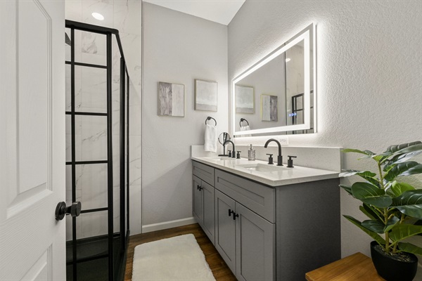 Bedroom 4 shares a spa-like, modern bath with Bedroom 3