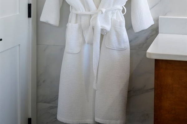 Luxurious robes and slippers are provided in each king suite.