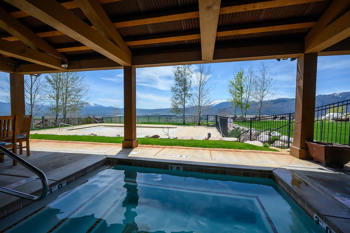 Take in the views from the covered community hot tub—soak, unwind, and enjoy the scenery year-round.