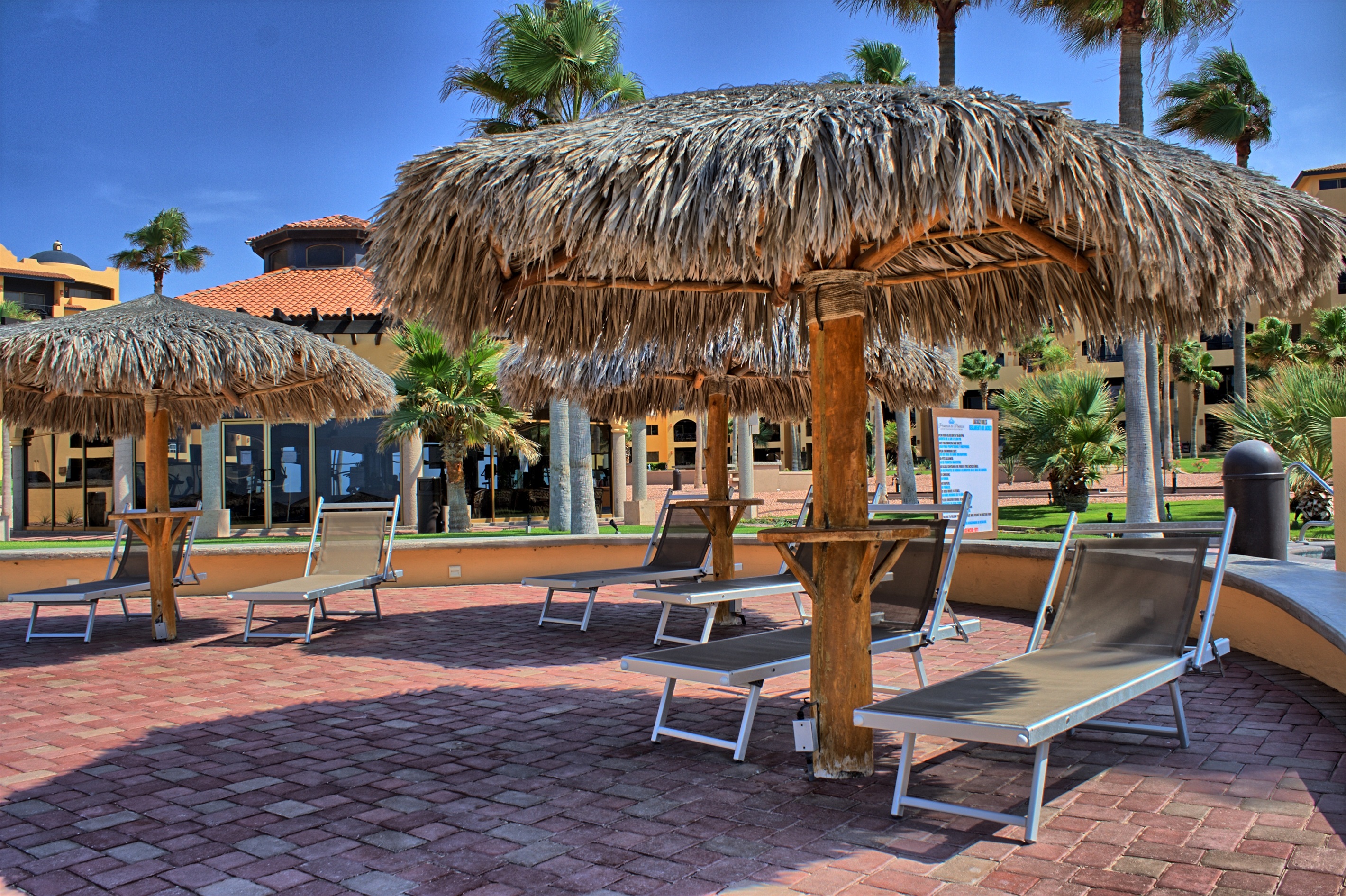 Palapas seating are near the beach