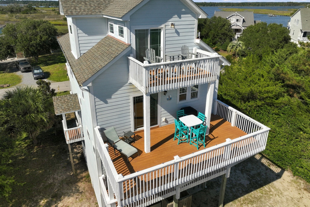 Spacious outdoor decks with multiple seating areas, perfect for relaxing and entertaining