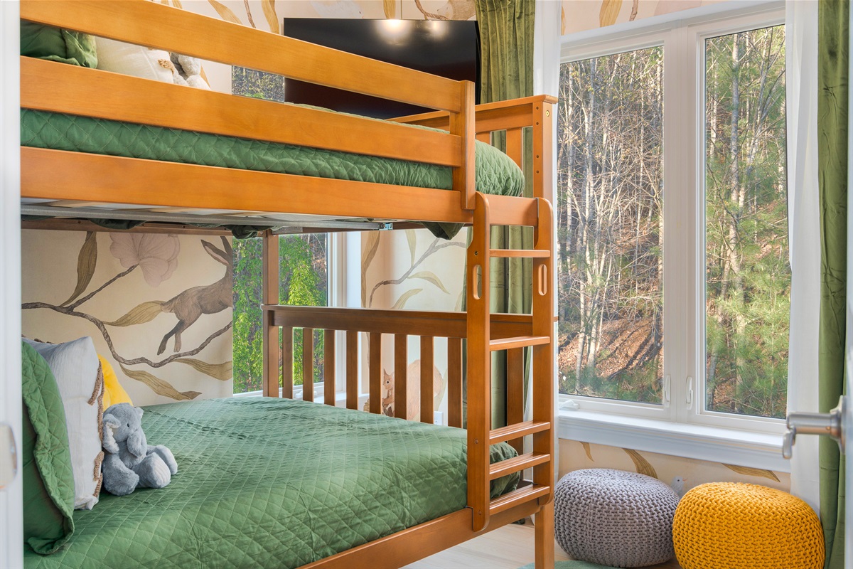 Bunk room setup with wooded views - perfect for kids or group-style sleeping arrangements