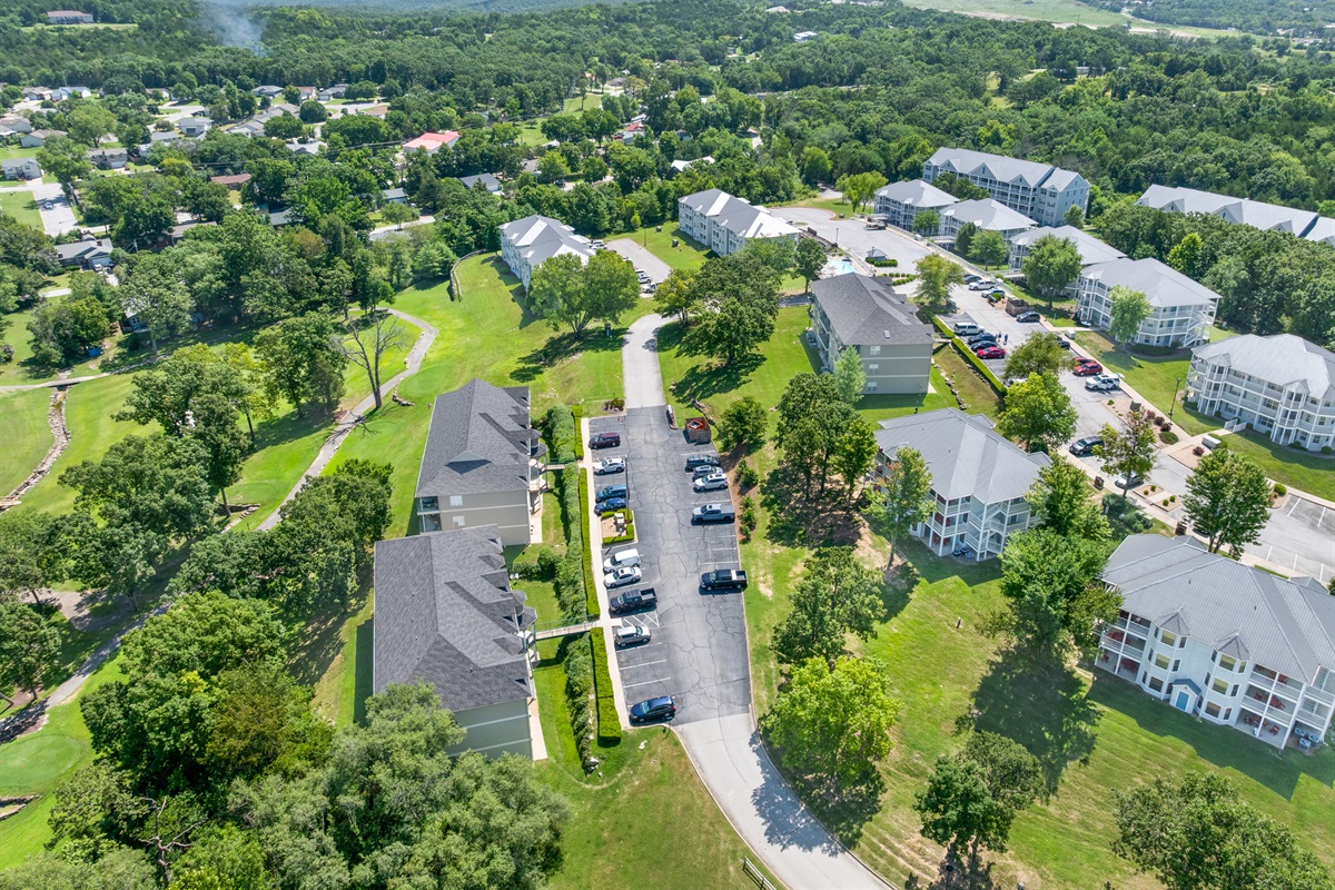 Broad overhead view places the condo within the larger resort and golf community.