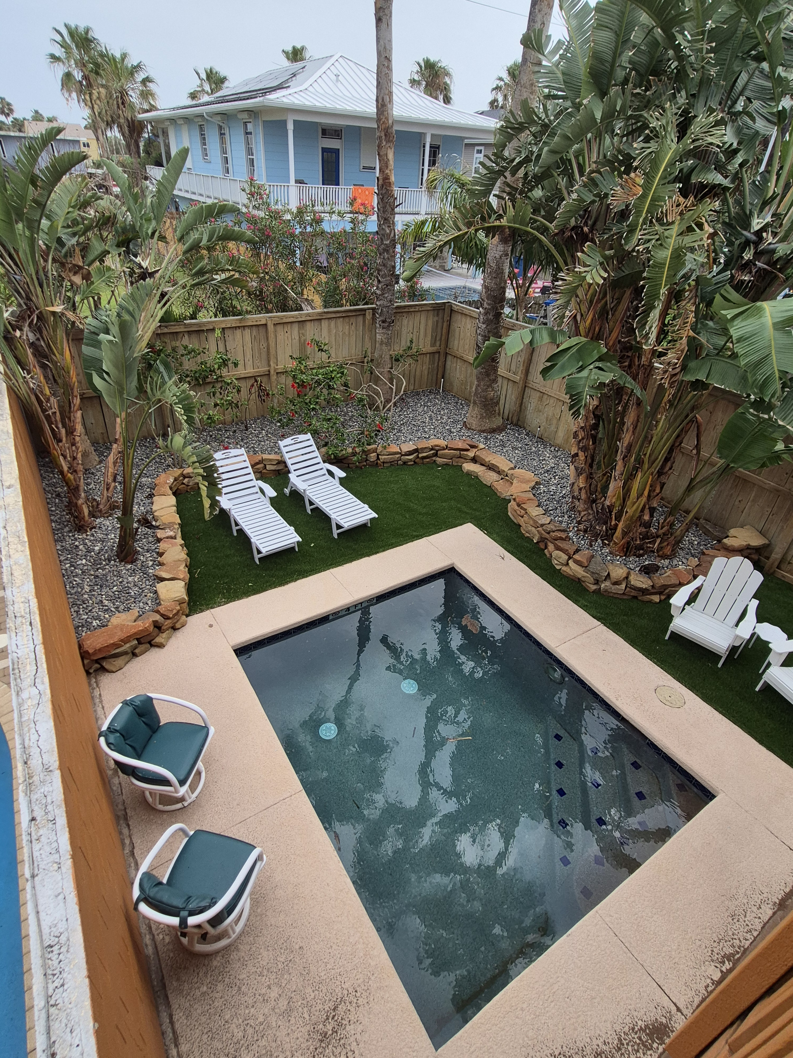 Unwind in our tropical backyard featuring thoughtfully designed landscaping, sparkling dipping pool, and lounge seating.