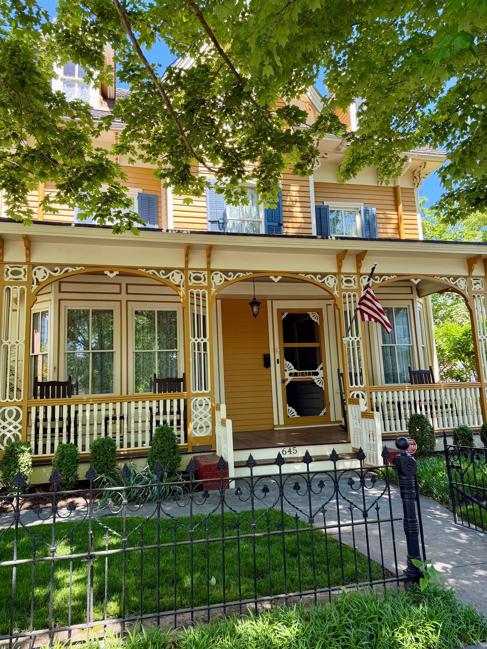 fenced yard is another rare amenity, and the wrought iron is a beautiful detail
