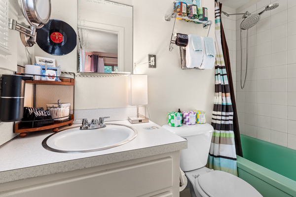 The bath — plush towels, a Dyson dryer, and everything stocked.