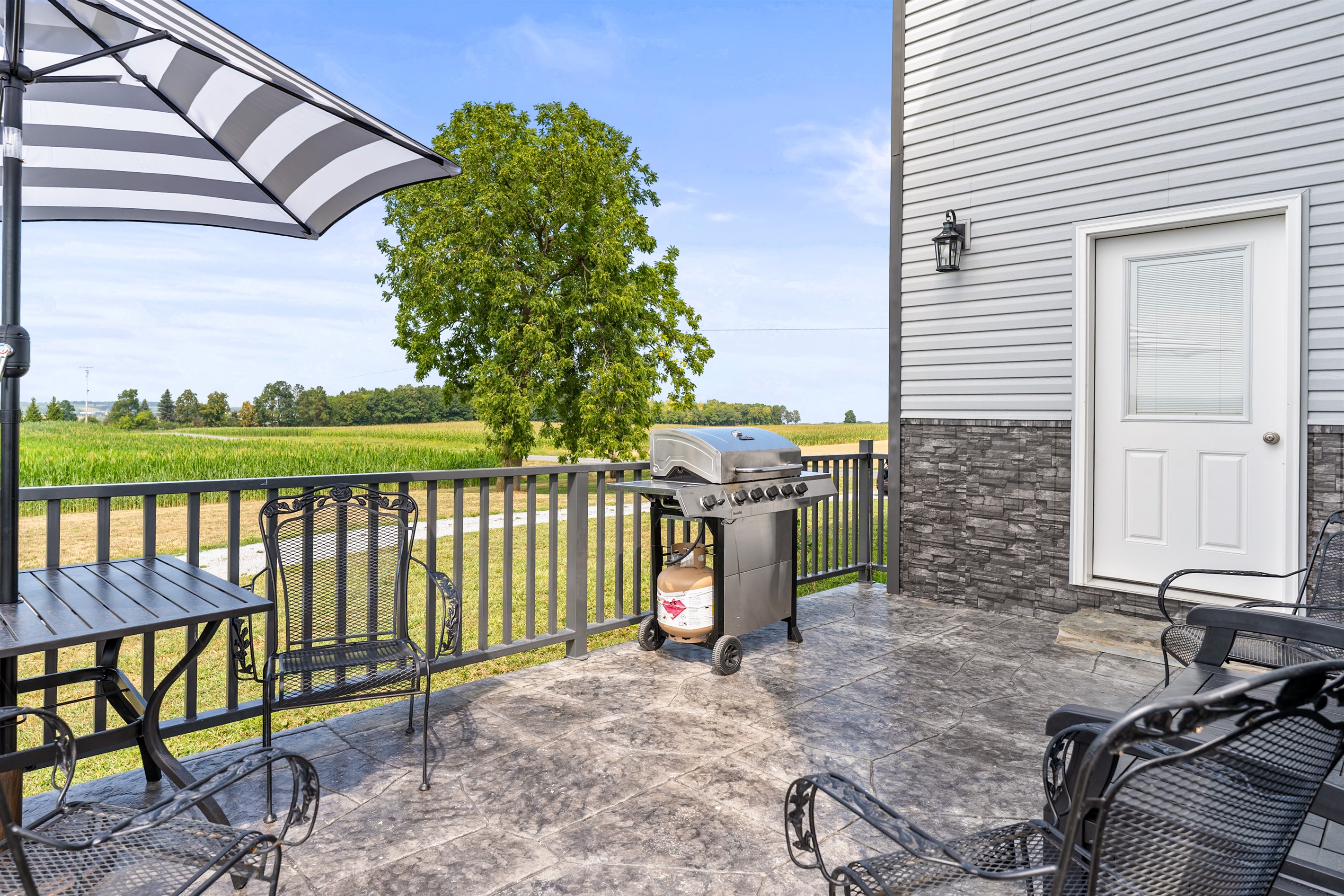 Enjoy country views while grilling on the spacious patio, complete with outdoor seating and plenty of room to relax.