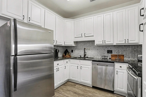 Fully equipped kitchen with stainless appliances for easy beach-week meals