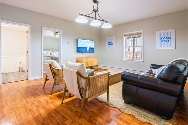 Our basement living room is your home away from home, a space to relax, laugh, and make memories with family and friends.