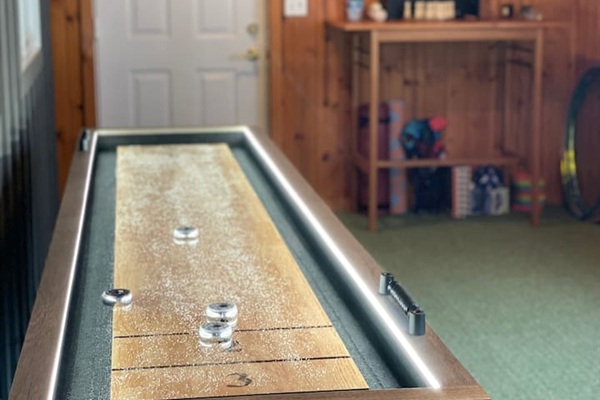 Shuffleboard game area perfect for friendly competition.