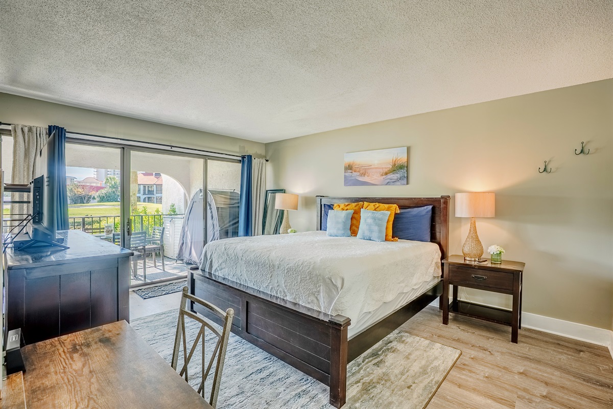 King bedroom with patio access