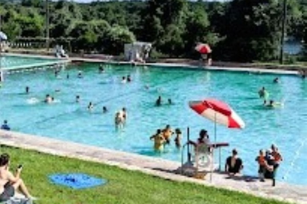 This Spring Fed Pool is Near the Lady Bird Hike and Bike Trail And Is Just A Ten Minute Drive From the House.   The Pool Features a Beach End, a Designated Lap Swim Area, A Bath House and Beverage and Snack Bar