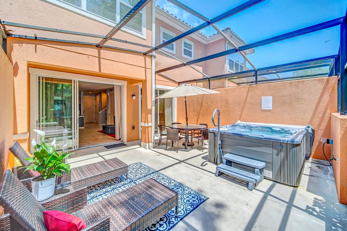 Private lanai with hot tub, lounge area and dining