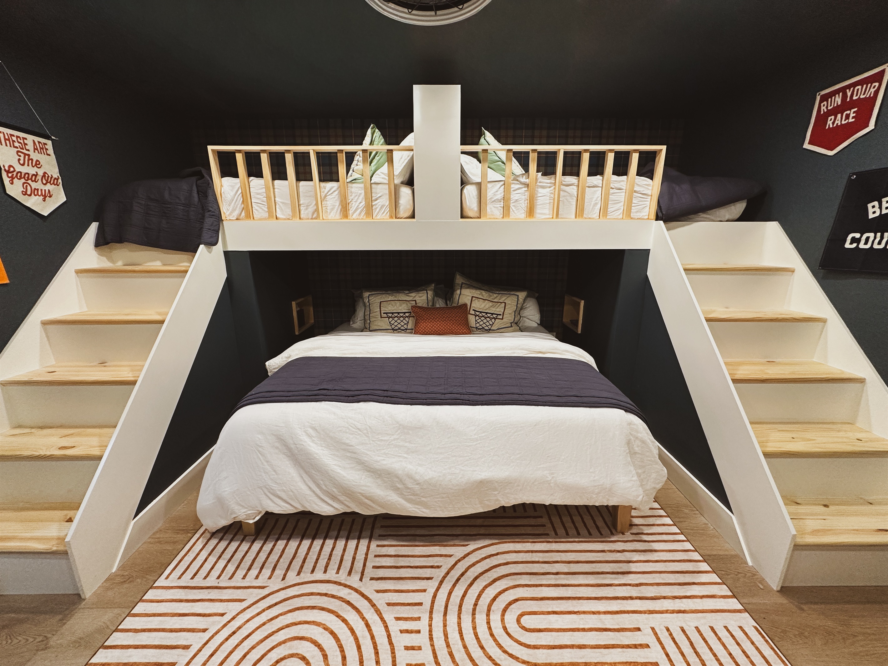 Welcome to the bunk room, our 3rd bedroom, is our custom built in double twin over king bunk suite. Twin beds have a headboard separating the two for privacy and separate stairs to bed. 