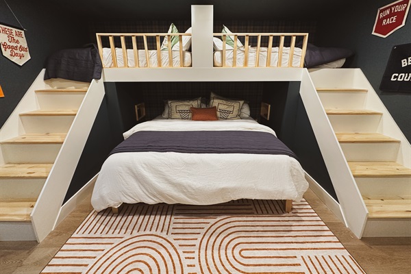 Welcome to the bunk room, our 3rd bedroom, is our custom built in double twin over king bunk suite. Twin beds have a headboard separating the two for privacy and separate stairs to bed. 