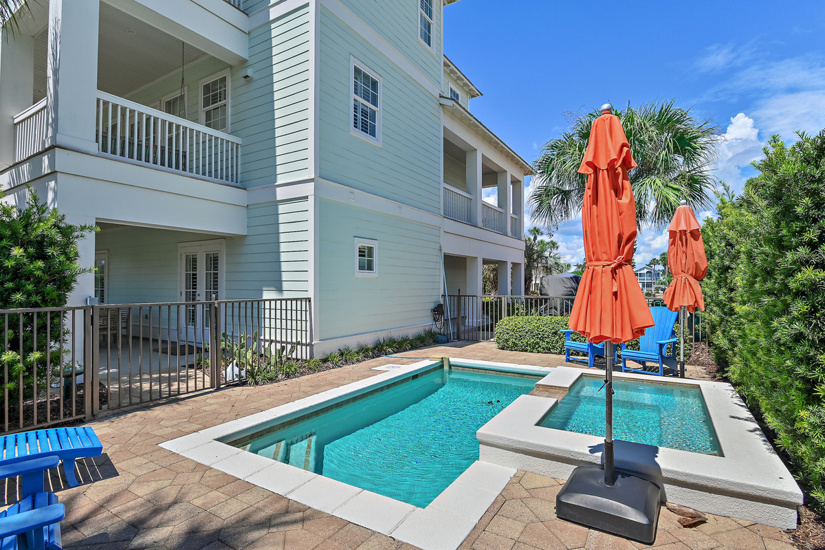 Enjoy sunny afternoons by the private pool and spa, surrounded by tropical palms and colorful coastal touches. The perfect place to relax, unwind, and make unforgettable 30A vacation memories.