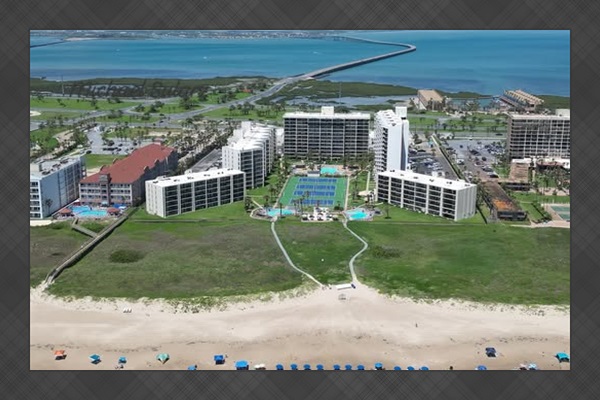 Aerial view looking at the Saida complex from above the beach.