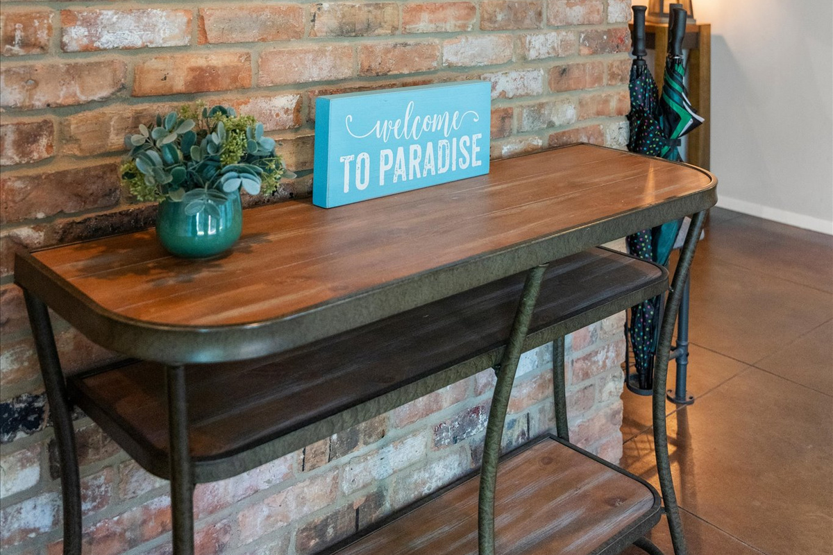This warm welcome greets you as you enter the lobby front door—'Welcome to Paradise!' Your home away from home awaits, offering comfort, relaxation, and a peaceful retreat.