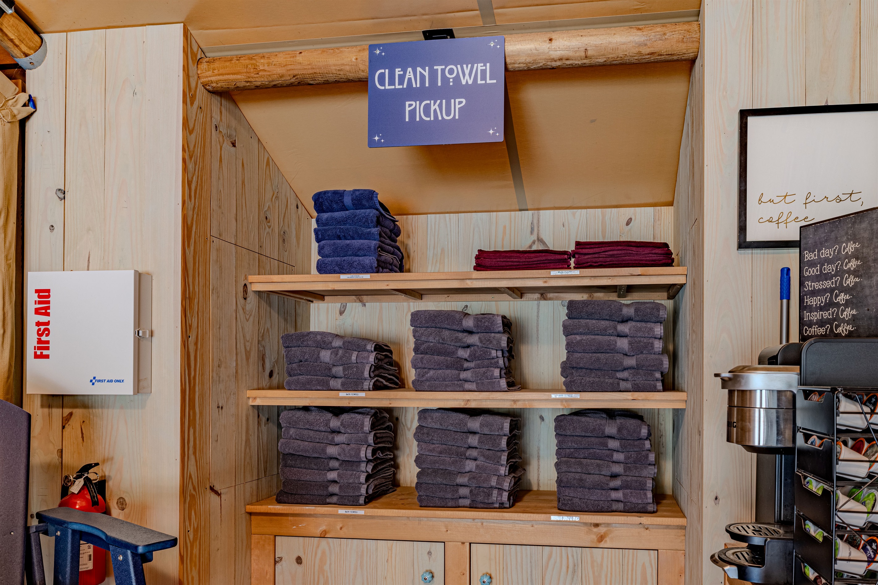 Well-stocked and always accessible. This dedicated area shows our commitment to guest convenience, providing both fresh, clearly labeled towels and important safety equipment.