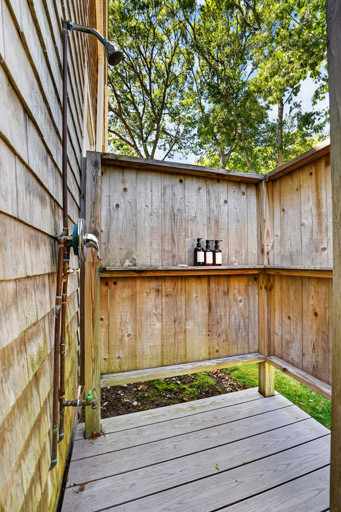 Enclosed outdoor shower, perfect for washing away sand before heading inside.