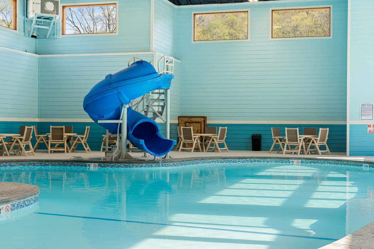 Splash down the indoor pool waterslide in any season,  a year-round family favorite at Tall Timbers Camp.