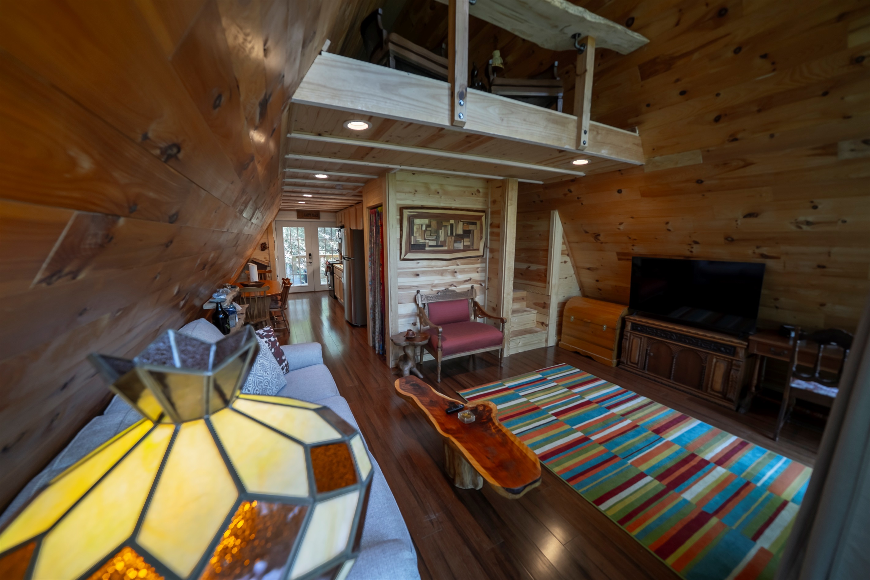 Kick back and relax with your favorite shows on the smart TV, all while enjoying the natural light and peaceful wooded views.