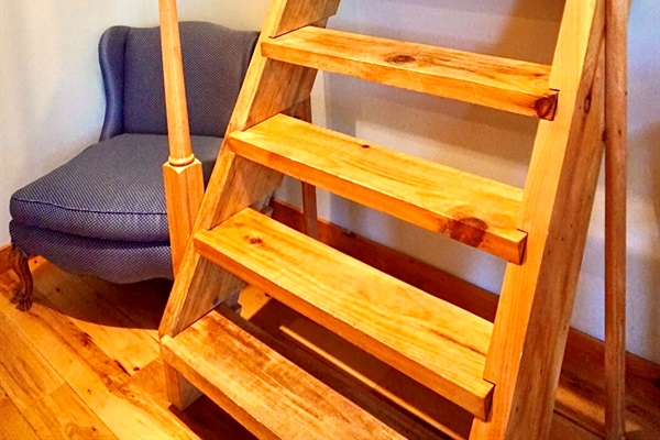 Loft Access: Ascend the charming wooden stairs to discover a serene retreat above!