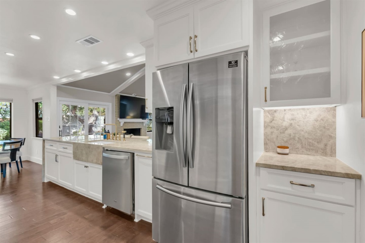 Full-size refrigerator with dedicated pantry space, offering plenty of room to store groceries and essentials for longer stays.