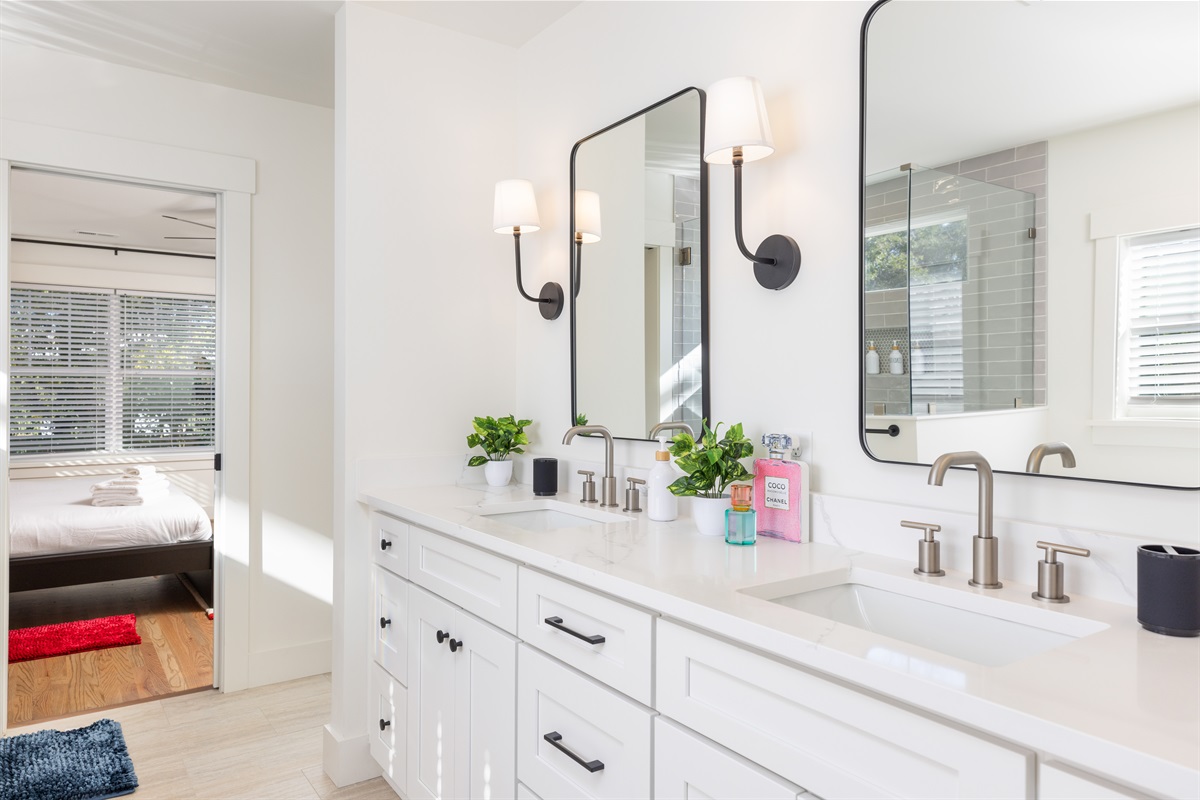 The luxury ensuite bathroom has a double vanity, walk-in shower, and also soaking tub.