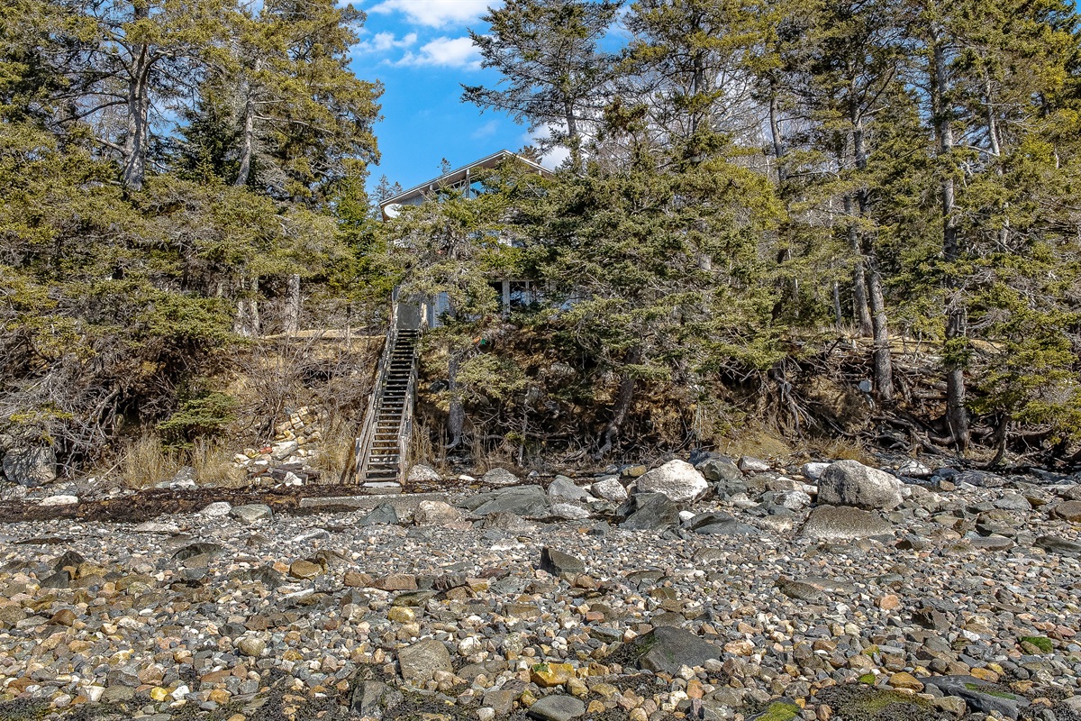 "Your Low Tide Playground."
Nestled among the pines and perched above a magnificent field of granite boulders. This wide view taken at low tide showcases the immense scale and total seclusion of our private waterfront.