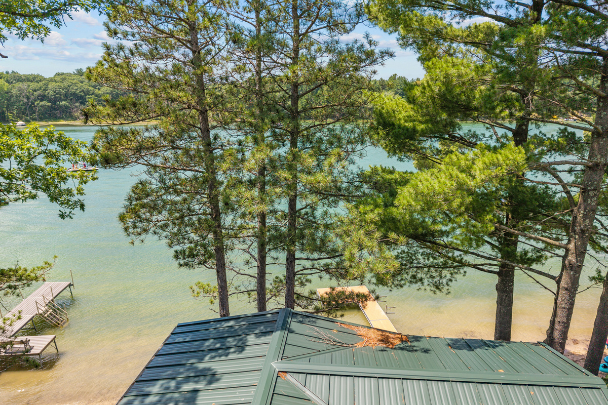 Take in sweeping lake views from the comfort of your bed in this charming upstairs space.